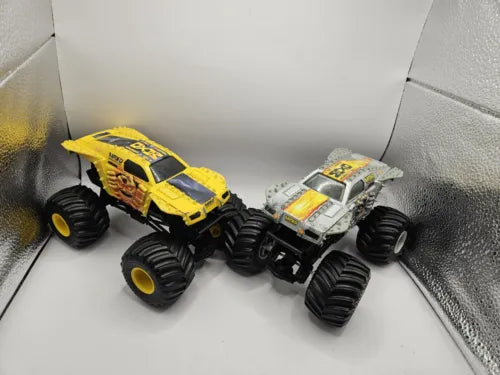 Yellow and silver monster jam 1/24 diecast trucks, two-pack
