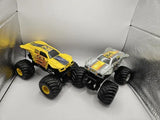 Yellow and silver monster jam 1/24 diecast trucks, two-pack