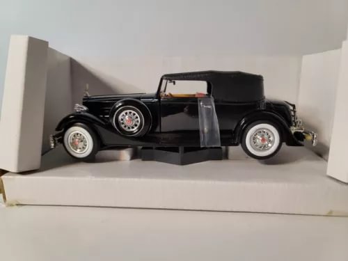 Black diecast 1934 Packard model car with chrome wheels and front grille