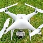 White quadcopter drone with front camera