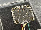 Drone ESC circuit board PCB with four mounting holes and soldered components