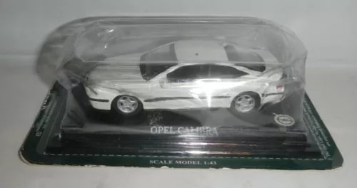 Diecast Opel Calibra 1:43 model car, white coupe with display base.