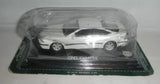 Diecast Opel Calibra 1:43 model car, white coupe with display base.