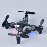 Mini quadcopter drone with four propellers and compact body
