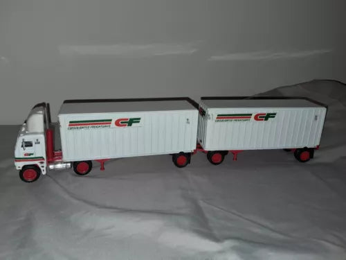 Die-cast tractor trailer toy with two white box trailers and red cab
