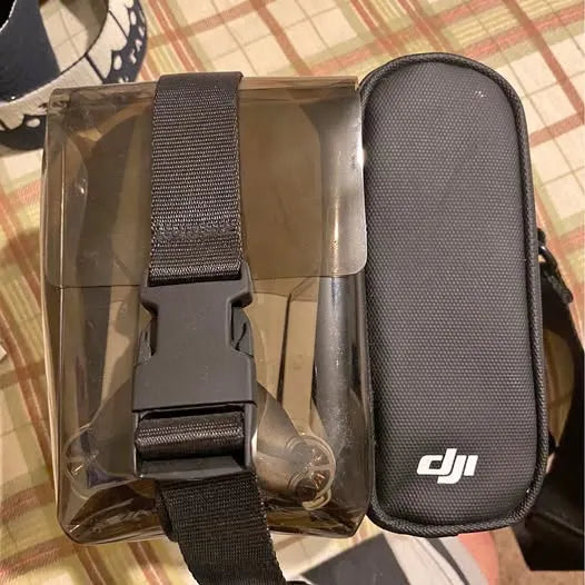 DJI Mavic Mini drone carrying case with mesh strap and gray hard shell
