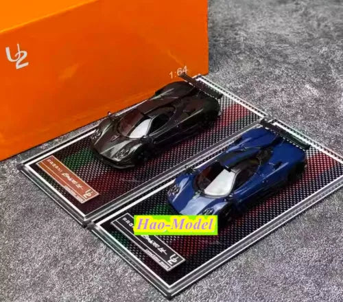 1/64 diecast car model set in open case, blue and black cars with details