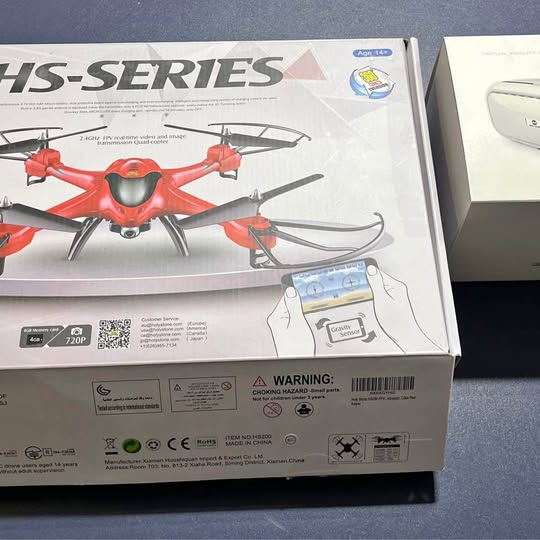 Red drone package with VR goggles shown on the box