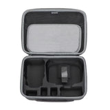 Hard travel drone carrying case with open top, foam compartments and mesh pocket