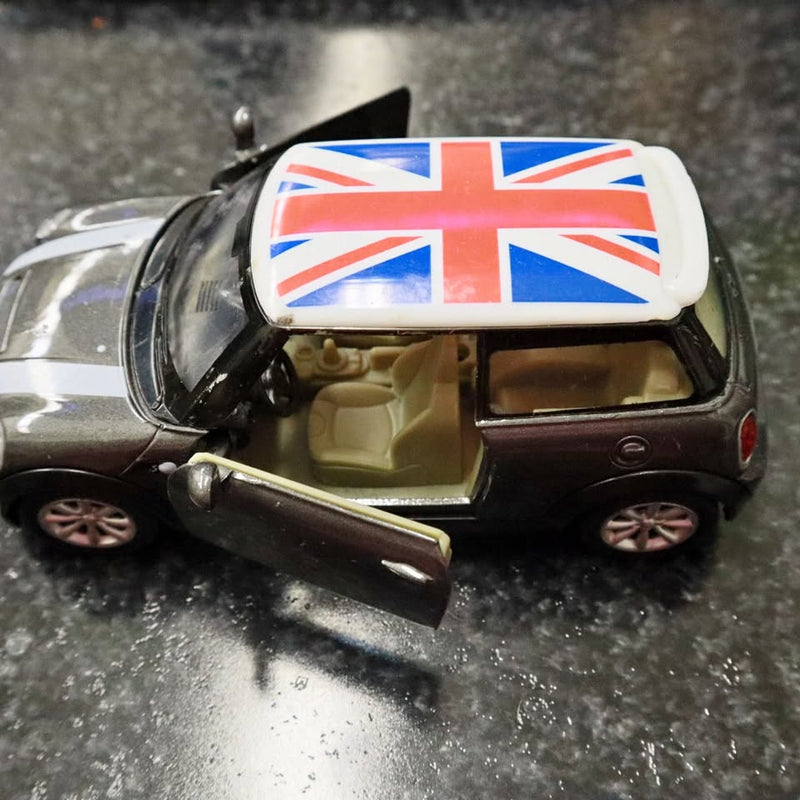 Grey diecast Mini Cooper model car with Union Jack roof