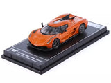 Orange diecast model car on black display base, front-left view
