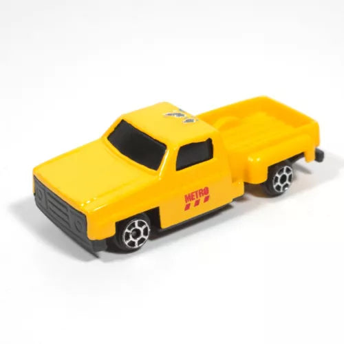 Yellow diecast pickup truck toy with black grille, dark windows, and chrome wheels