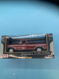 Die-cast 1979 Ford F-150 pickup truck in retail box, maroon with white wheels