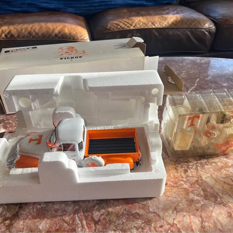 Danbury Mint diecast pickup truck in foam insert, white cab with orange bed interior