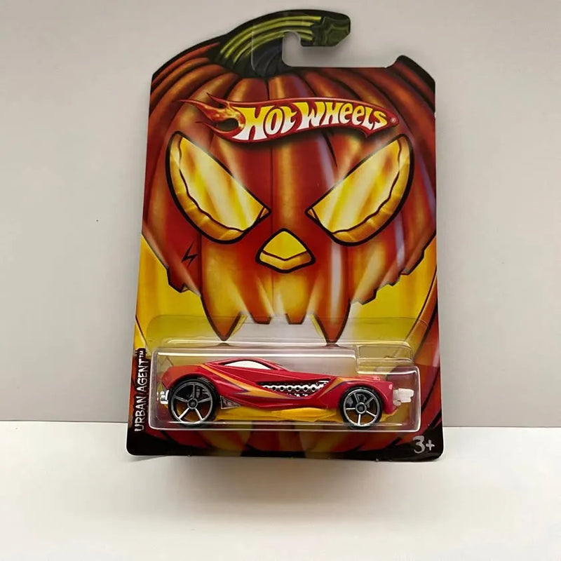 Diecast toy car in blister pack with jack-o'-lantern graphic, red car with black wheels