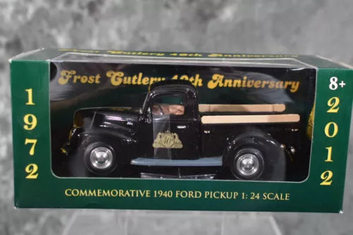 Packaged 1:24 scale diecast 1940 Ford pickup truck, black with cream stripe