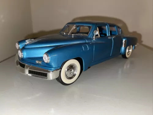 1948 Tucker metallic blue diecast car, 1:18 scale, front three-quarter view