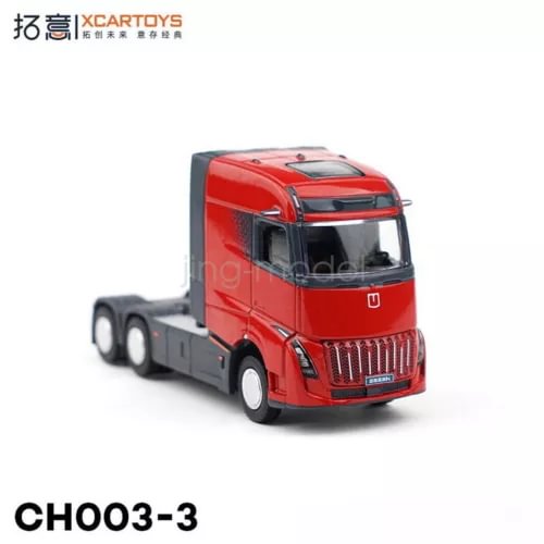 Red diecast tractor truck model with gray chassis, front cab and grille details.