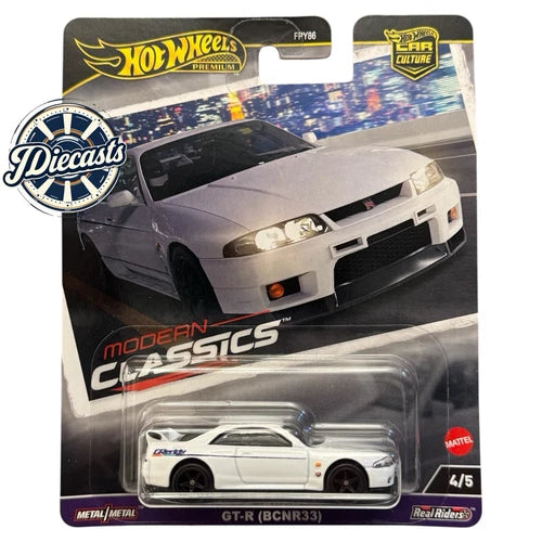 1:64 diecast Nissan Skyline R33 GT-R in blister pack, light gray with black stripe