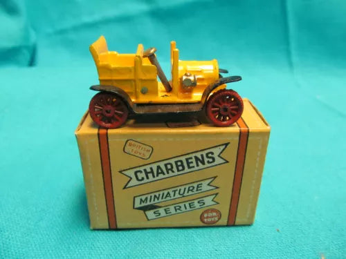 Diecast toy car in CHARBENS box, yellow vehicle