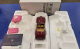 Maroon 1:24 diecast Packard Victoria convertible model in open packaging tray
