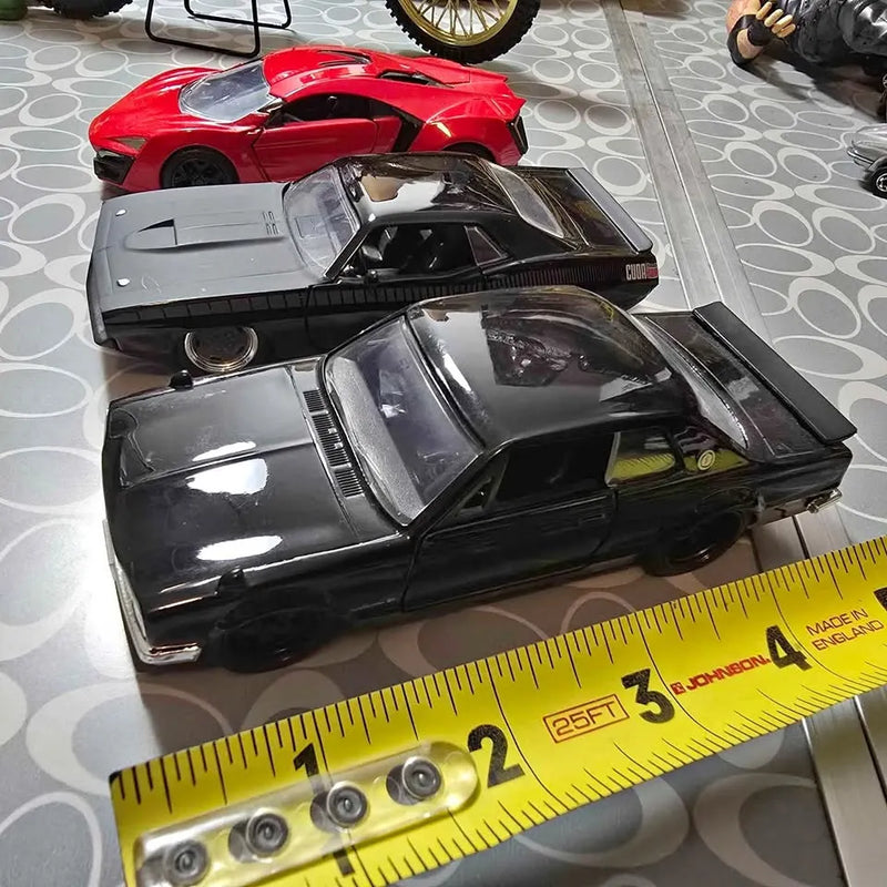 Red and black diecast cars, front views with clear windows and decals