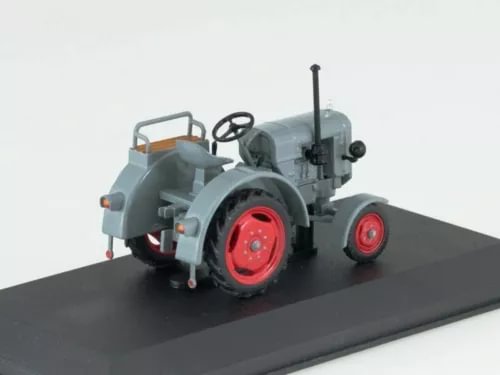Diecast tractor model with gray body and red wheels, front view, raised exhaust pipe