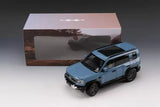 1/18 scale diecast car model toy in blue, front three-quarter view