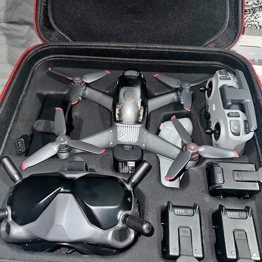 Foldable quadcopter drone kit in a hard case with remote and batteries