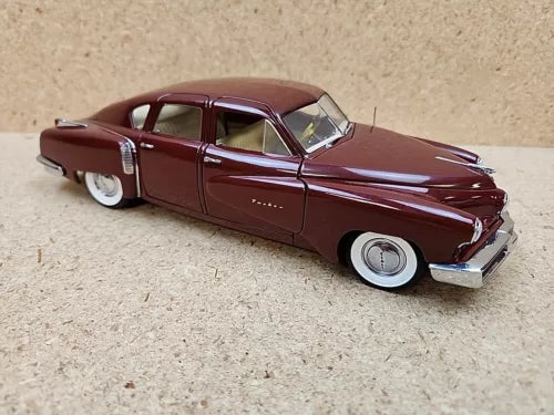 Maroon 1:24 scale diecast 1948 Tucker tin goose car model with chrome details