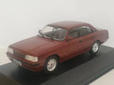 Diecast model car, dark red 2-door coupe with detailed headlights and chrome grille