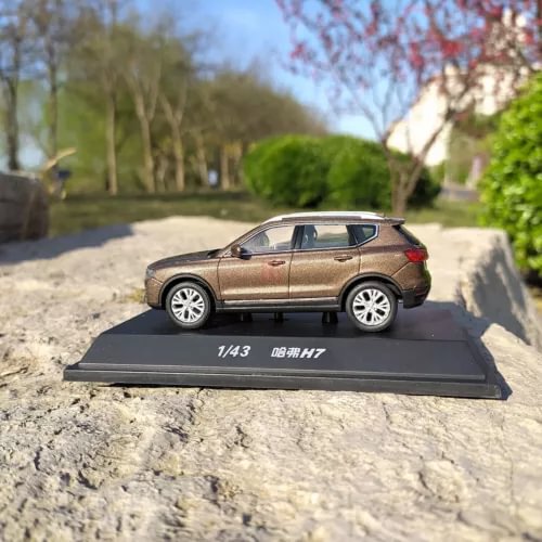 Brown 1:43 Haval H7 diecast SUV model on display base, side view