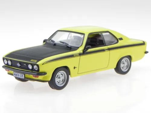 Yellow and black diecast model car with white wheels, front three-quarter view.