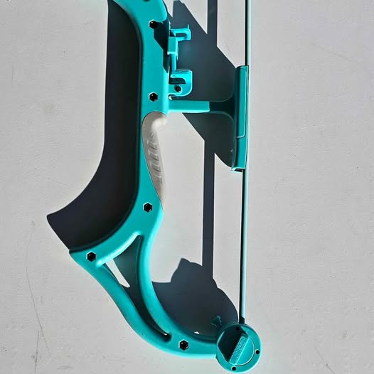 Teal and black drone frame component with mounting holes