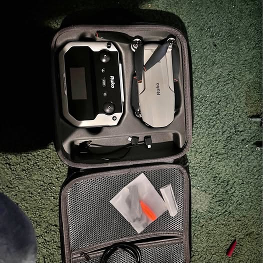 Roku F11 Pro drone in zippered carrying case with controller and prop set