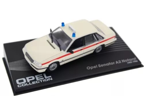 White Opel Senator A2 Notarzt diecast model car with blue emergency lights on display base