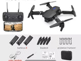 RC drone with remote controller and spare batteries, blades, and prop protection frame.
