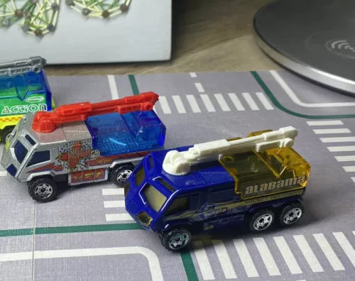 Blue and red diecast fire pumper truck with Alabama lettering, front 3/4 view.