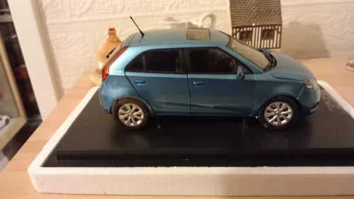 Blue diecast hatchback car model 1:18 scale in box