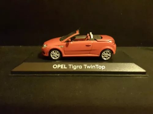 Orange 2004 Opel Tigra TwinTop diecast car, 1:43 scale, on display base