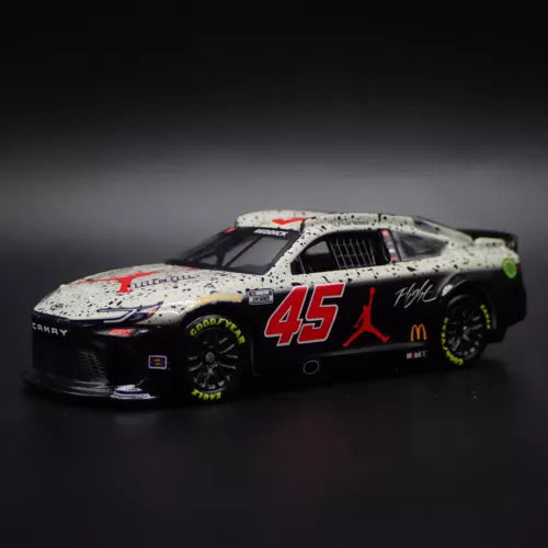 1:64 scale diecast NASCAR model car, black with white speckles and red #45 graphics