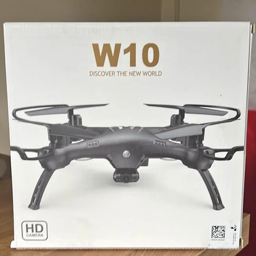 Attop W10 drone, dark grey quadcopter with four arms and front camera module