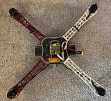 450mm quadcopter drone frame with motors and exposed electronics