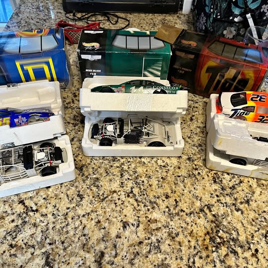 White NASCAR diecast race car model with visible engine detail
