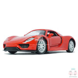 Red diecast model car, 1:36 scale, front three-quarter view with detailed wheels.
