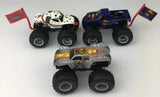 Monster Jam diecast truck set with two multicolor monster trucks, large treaded tires