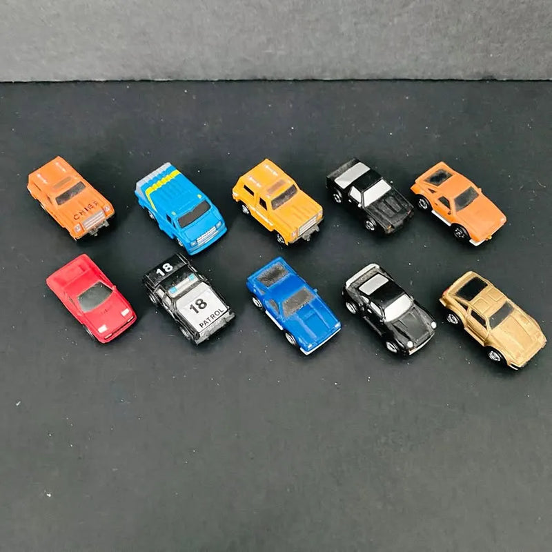 Diecast toy cars and trucks assortment in orange, blue, yellow, black, red, and beige