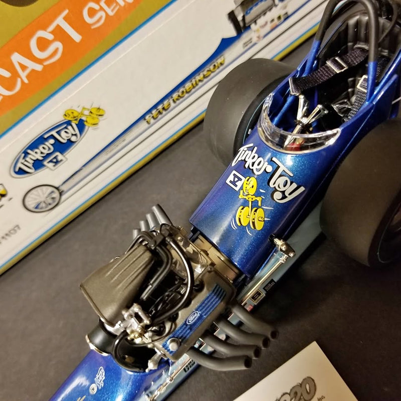 Blue and silver diecast racing model car with front and side detail, front view.