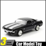 Black 1969-style muscle car die-cast model toy with white stripe hood