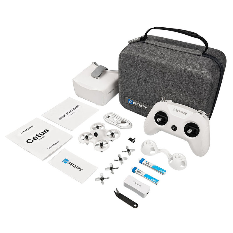 FPV drone kit with gray carry case, white controller, and quadcopter parts